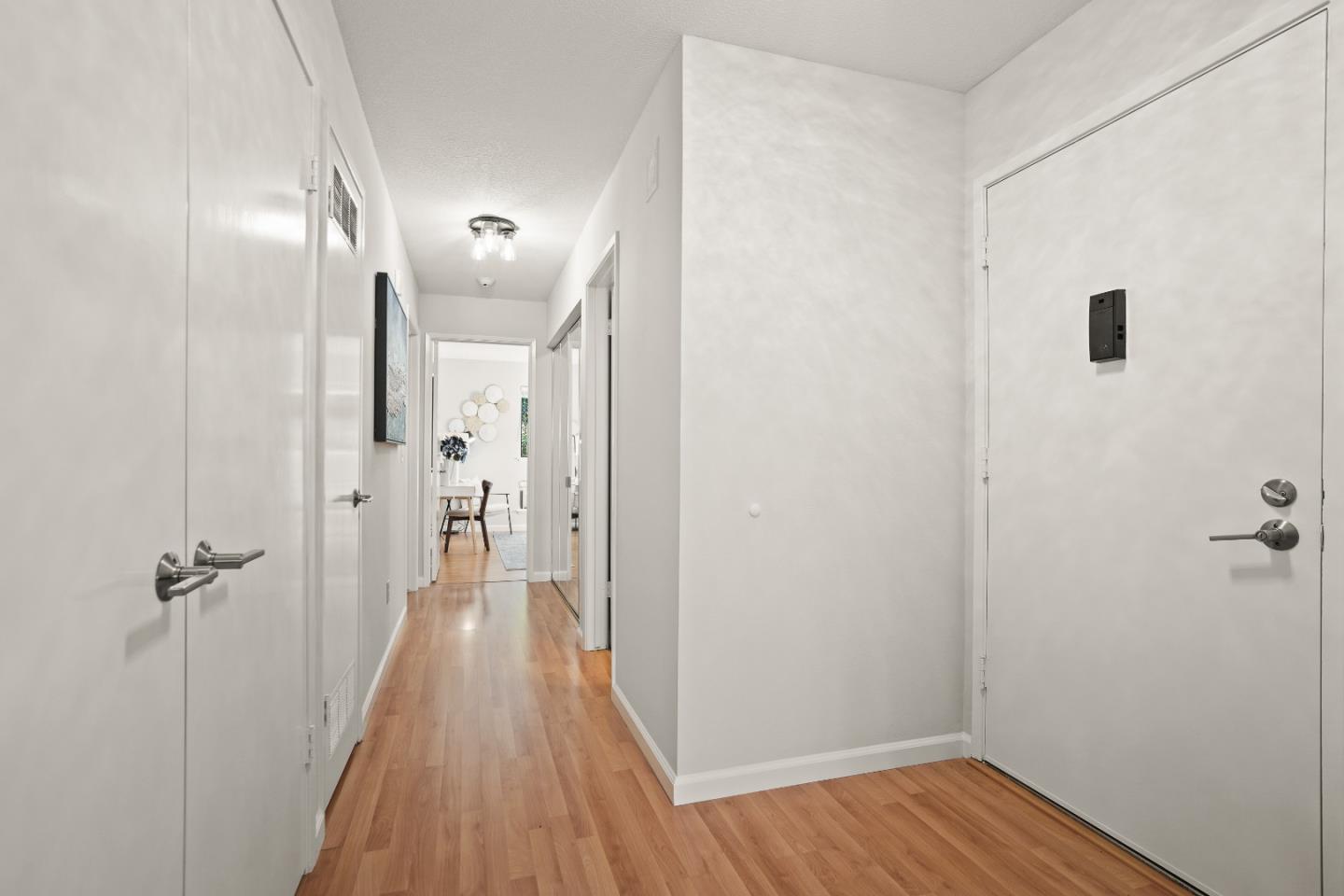928 Wright Avenue, Unit 1005 Mountain View, CA 94043 - Photo 10 of 25 a view of a hallway with wooden floor