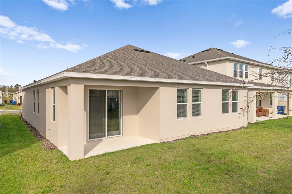 851 Vineyard Rdg Road Minneola, FL 34715 - Photo 13 of 13 a view of a house with a yard