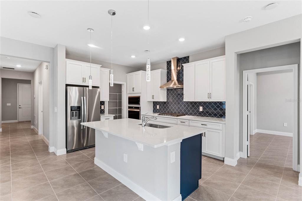 851 Vineyard Rdg Road Minneola, FL 34715 - Photo 5 of 13 a kitchen with refrigerator and cabinets