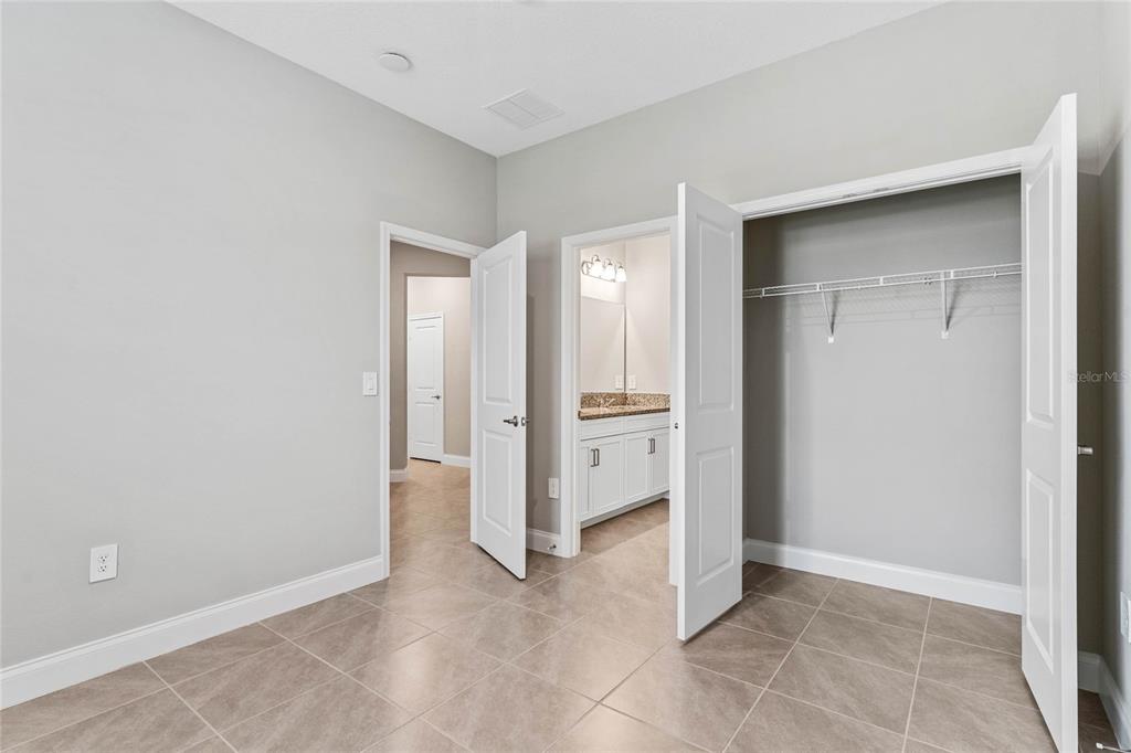 851 Vineyard Rdg Road Minneola, FL 34715 - Photo 9 of 13 an empty room with closet and a bathroom
