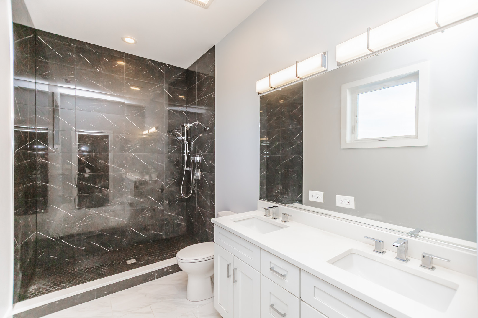 2018 South Loomis Street, Unit 3 Chicago, IL 60608 - Photo 15 of 22 a bathroom with a shower sink mirror and toilet