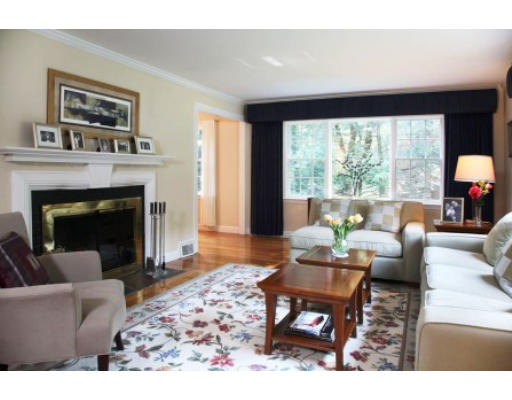 73 Elmwood Road Wellesley, MA 02481 - Photo 3 of 10 a living room with furniture a large window and a fireplace