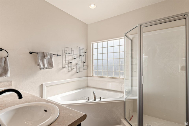 345 North 2450th Street East, Unit 152 St. George, UT 84790 - Photo 21 of 40 Full bathroom with double vanity, a stall shower, a bath, and recessed lighting