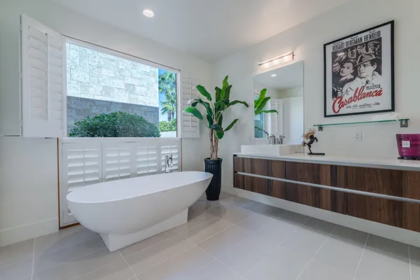a bathroom with a bathtub and sink