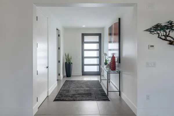 a view of a hallway view with staircase