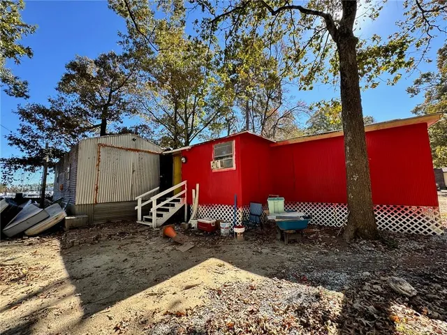 a view of a backyard with large trees