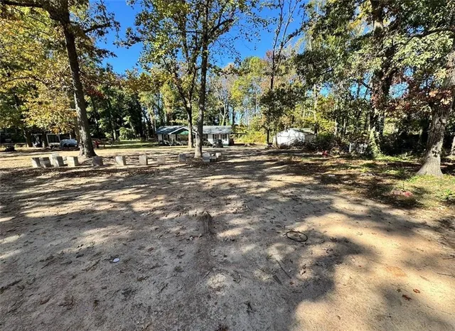 a view of a tree in front of a house