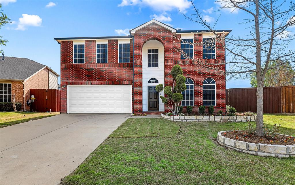 a front view of a house with a yard fire pit and outdoor seating