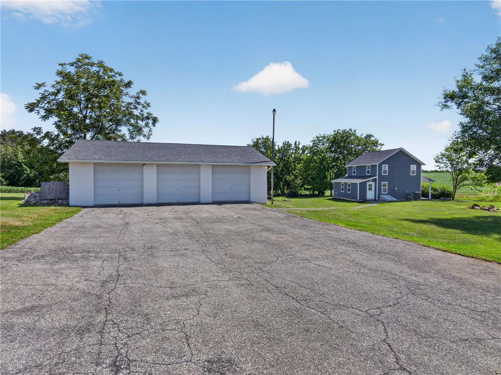 291 East Dannersville Road Bath, PA 18014 - Photo 21 of 46 A spacious driveway leads to a triple garage, offering ample parking and storage.