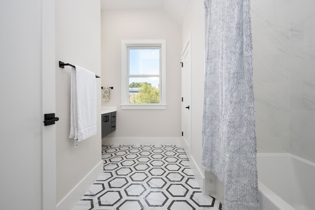 10 Hardan Road, Unit 10 Somerville, MA 02144 - Photo 11 of 22 a bathroom with a bathtub and a shower