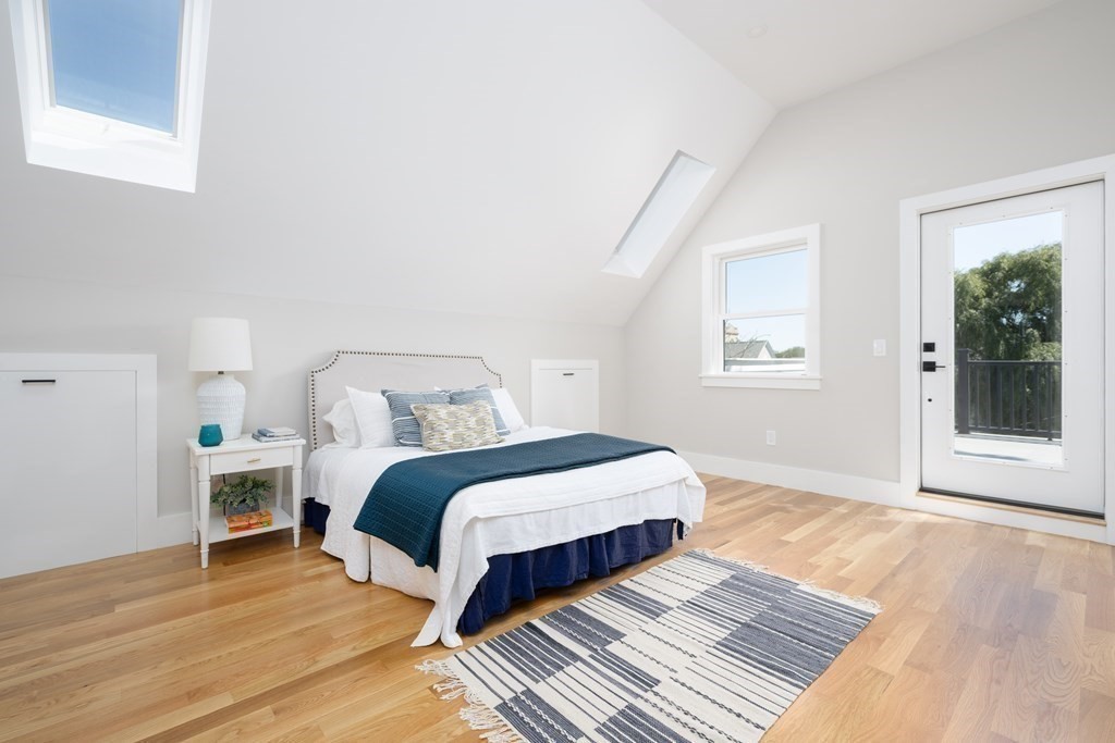 10 Hardan Road, Unit 10 Somerville, MA 02144 - Photo 14 of 22 a spacious bedroom with a bed and wooden floor