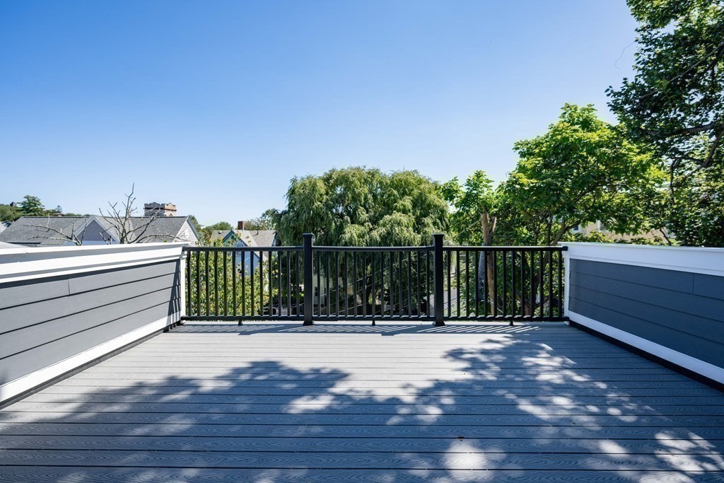 10 Hardan Road, Unit 10 Somerville, MA 02144 - Photo 19 of 22 a view of a balcony with wooden fence