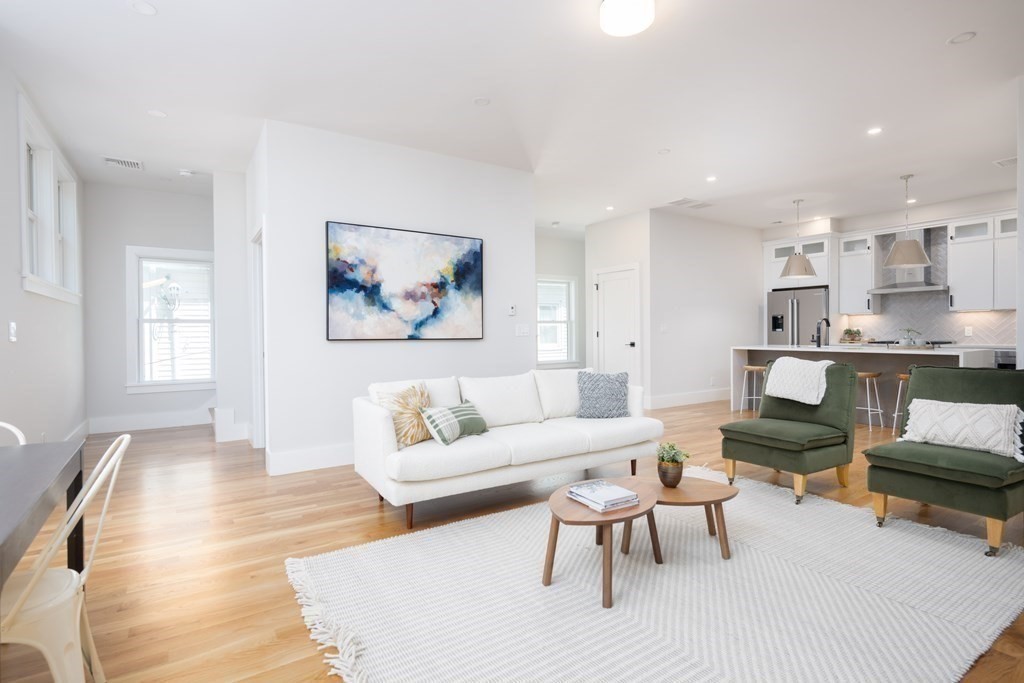 10 Hardan Road, Unit 10 Somerville, MA 02144 - Photo 2 of 22 a living room with furniture and a couch