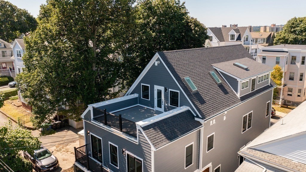 10 Hardan Road, Unit 10 Somerville, MA 02144 - Photo 21 of 22 a view of a house with a trees