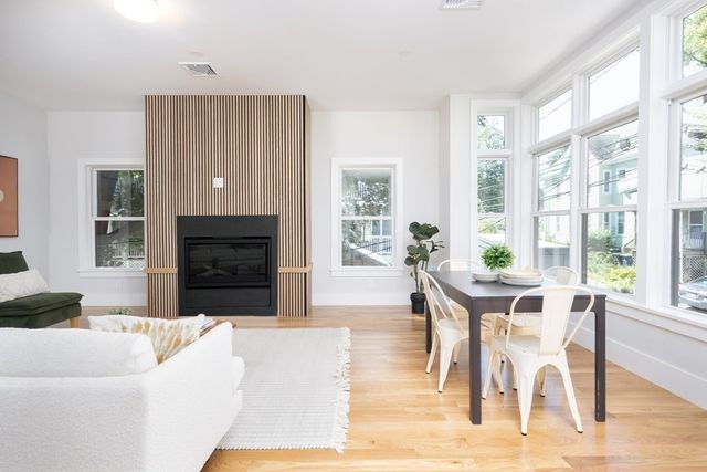 a view of a livingroom with furniture window and wooden floor