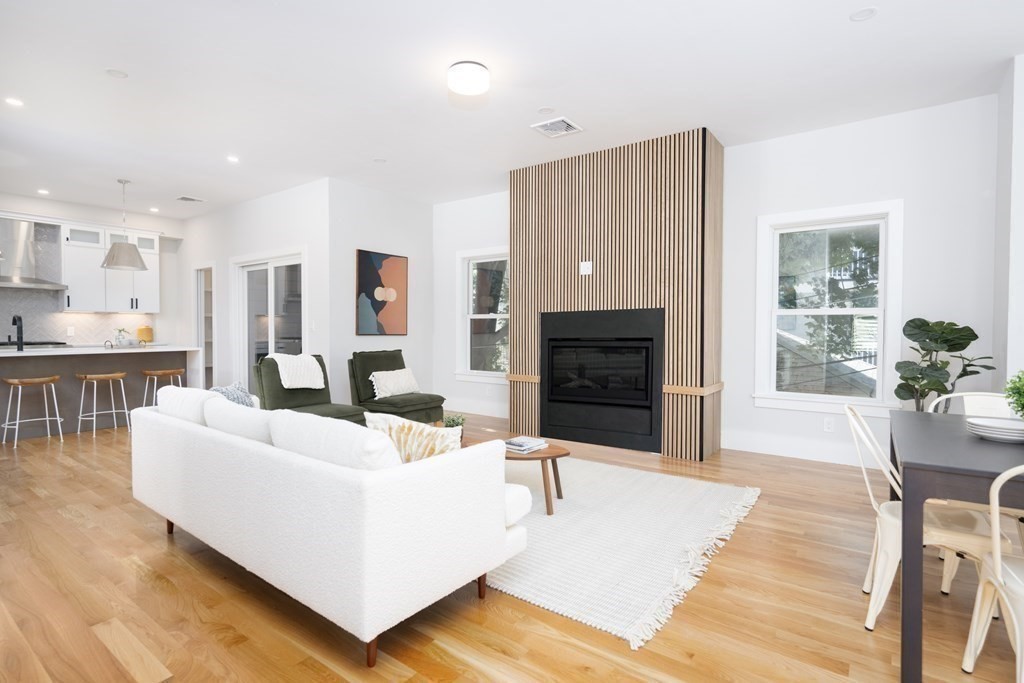 10 Hardan Road, Unit 10 Somerville, MA 02144 - Photo 4 of 22 a living room with furniture and a fireplace
