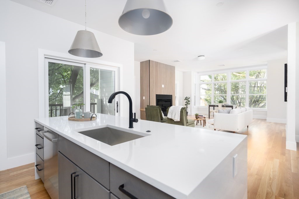 10 Hardan Road, Unit 10 Somerville, MA 02144 - Photo 6 of 22 a large white kitchen with a large window