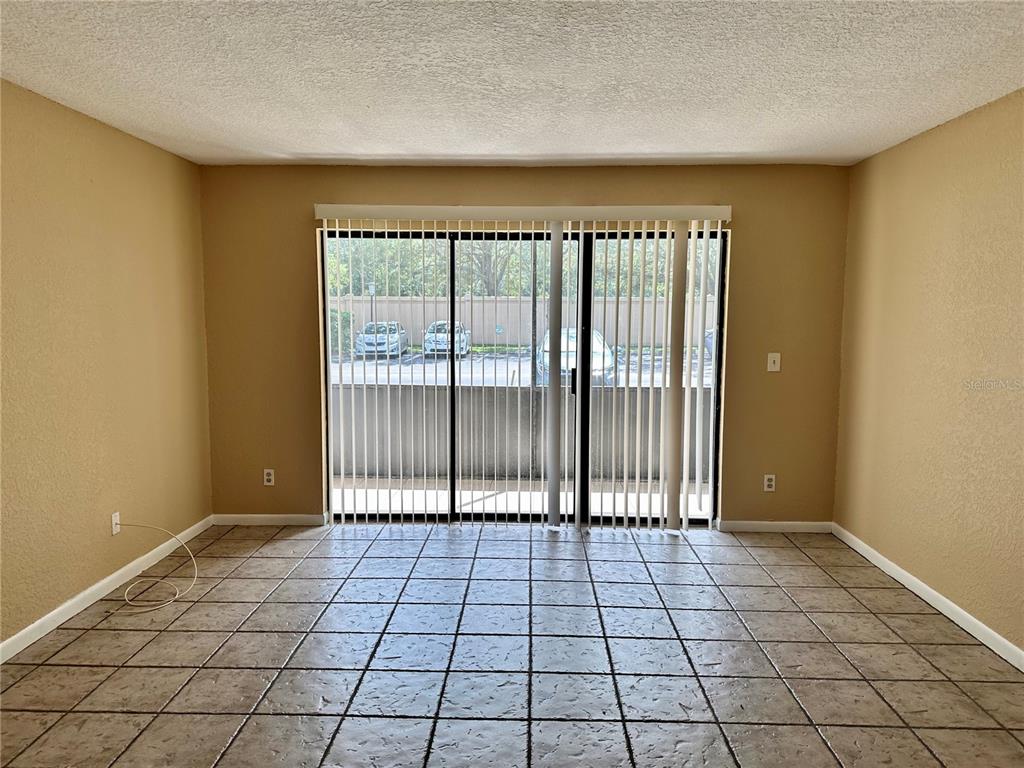 8205 Sun Spring Circle, Unit B1 Orlando, FL 32825 - Photo 4 of 14 a view of a room with windows