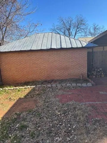 a view of a backyard of the house