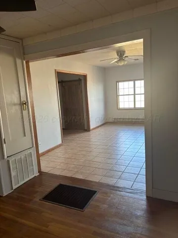 a view of an empty room with a window