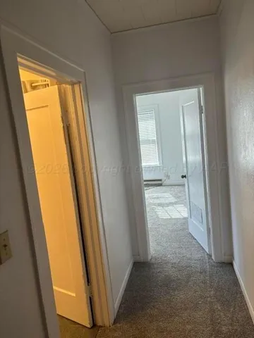 a view of a porch with wooden floor