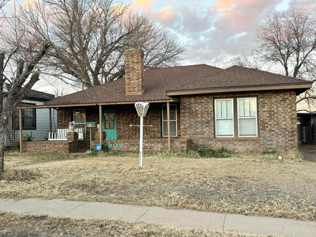 a front view of a house with a garden and porch