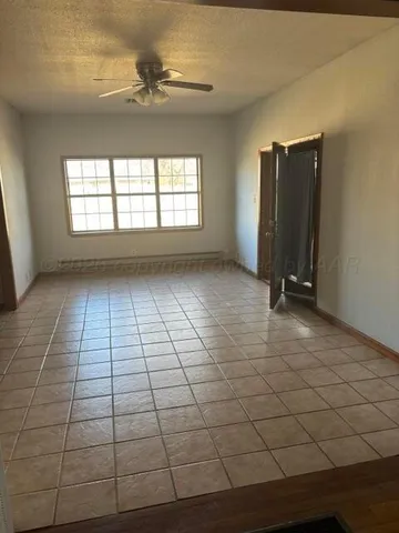 a view of a kitchen with cabinet and a chandelier
