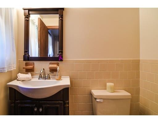42 Larnis Road Framingham, MA 01701 - Photo 13 of 25 a bathroom with a sink a mirror and a toilet