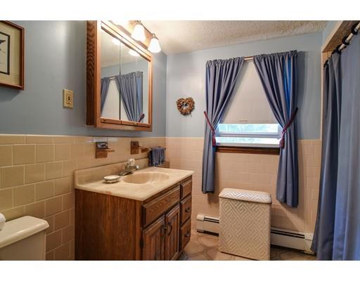 42 Larnis Road Framingham, MA 01701 - Photo 17 of 25 a bathroom with a sink a toilet and mirror