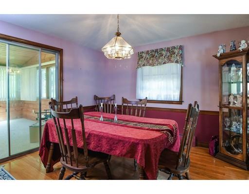42 Larnis Road Framingham, MA 01701 - Photo 8 of 25 a view of a dining room with furniture and a chandelier