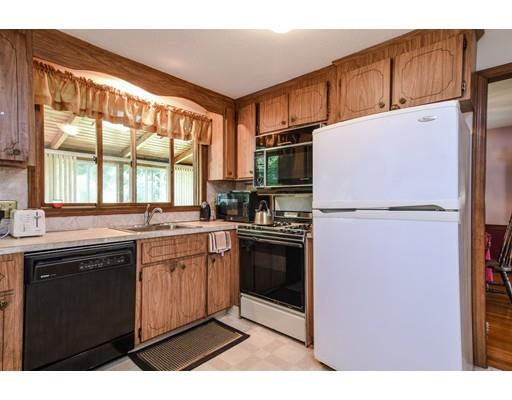 42 Larnis Road Framingham, MA 01701 - Photo 10 of 25 a kitchen with stainless steel appliances granite countertop a refrigerator a sink a stove and white cabinets