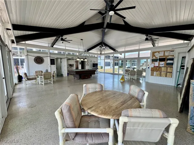 a dining room with a table tennis table and chairs