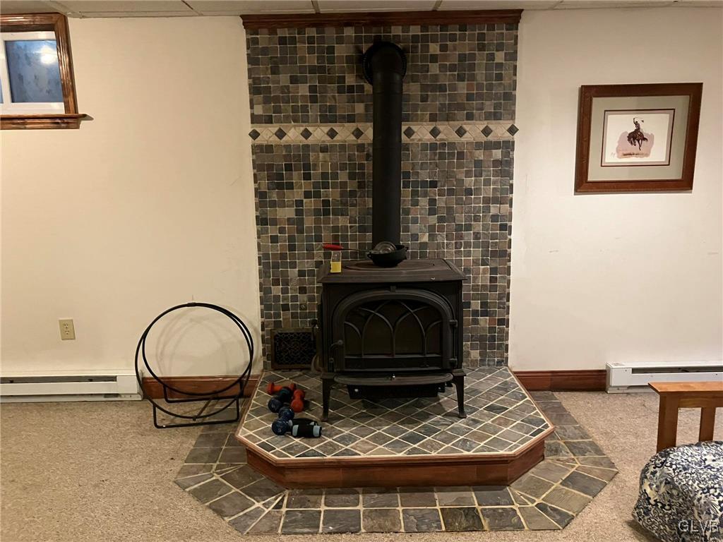 4290 Wellesley Road Bethlehem, PA 18017 - Photo 35 of 50 Wood stove with floor to ceiling decorative tile,
