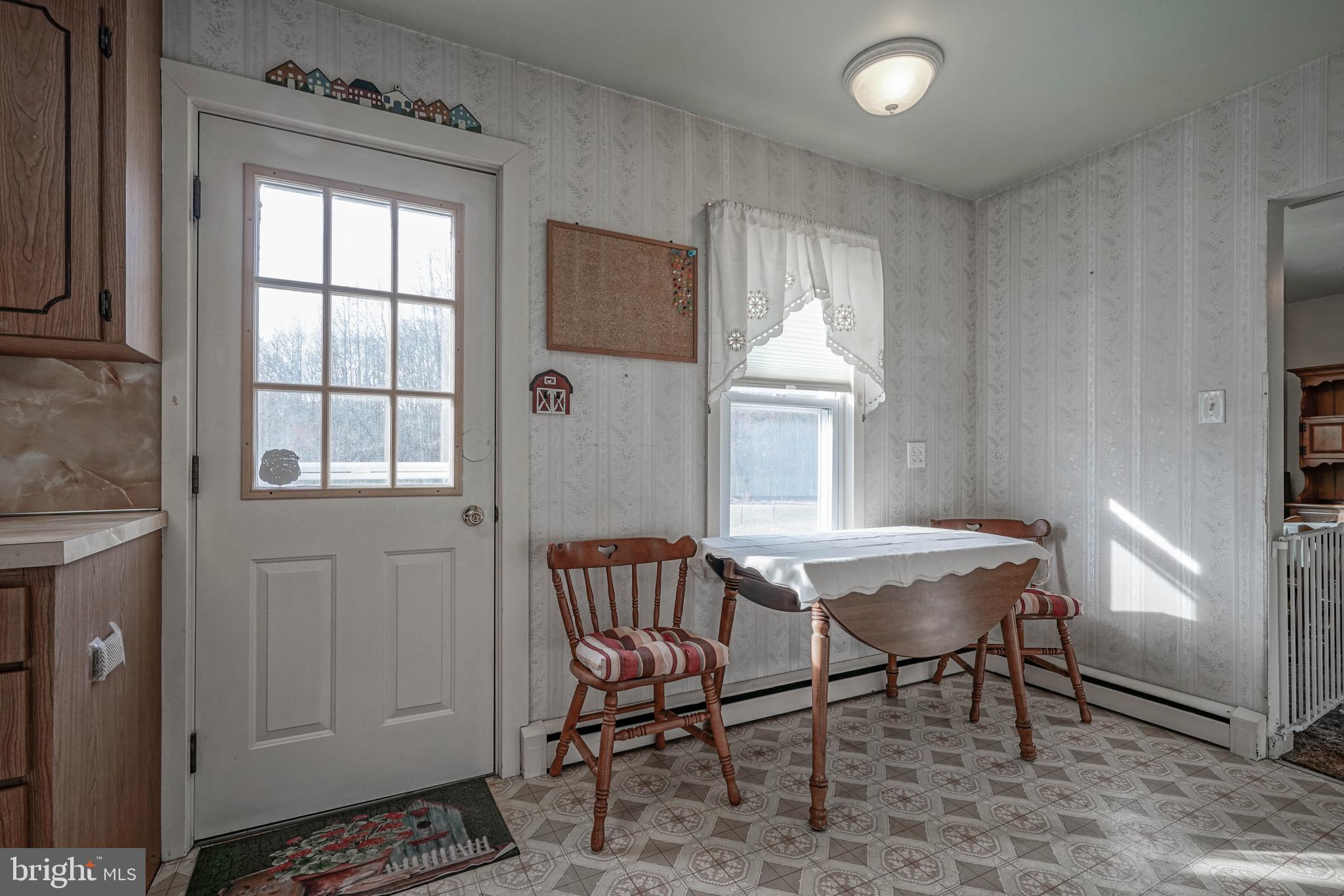 249 Cleveland Avenue Carneys Point, NJ 08069 - Photo 13 of 52 a view of a dining room with furniture window and wooden floor