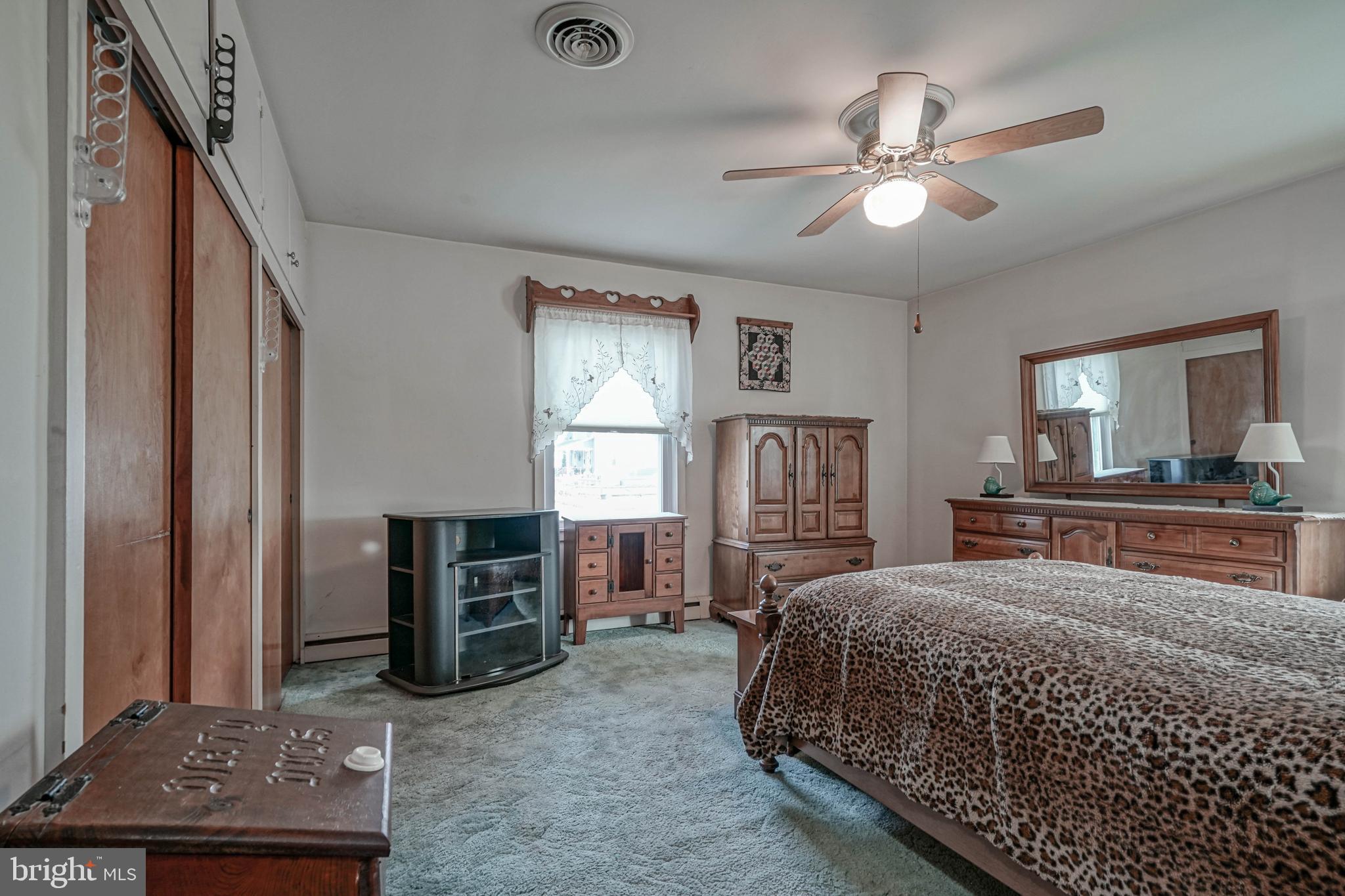 249 Cleveland Avenue Carneys Point, NJ 08069 - Photo 18 of 52 a bedroom with a bed and a mirror on dresser