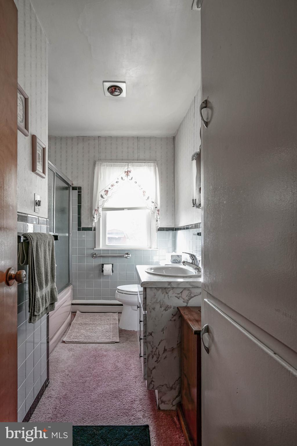 249 Cleveland Avenue Carneys Point, NJ 08069 - Photo 23 of 52 a kitchen with a sink cabinets and window