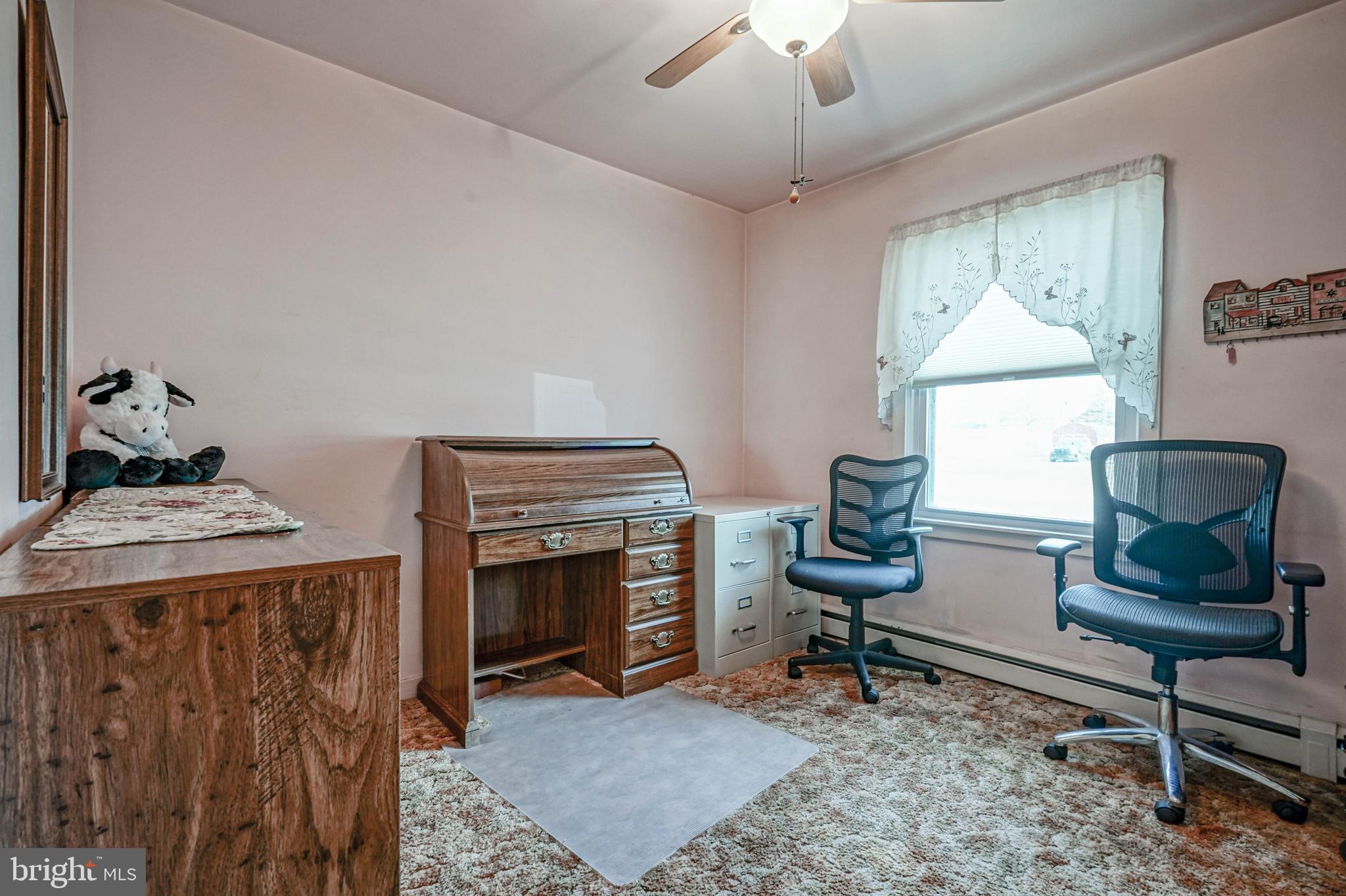 249 Cleveland Avenue Carneys Point, NJ 08069 - Photo 24 of 52 a living room with furniture a fireplace and a chandelier
