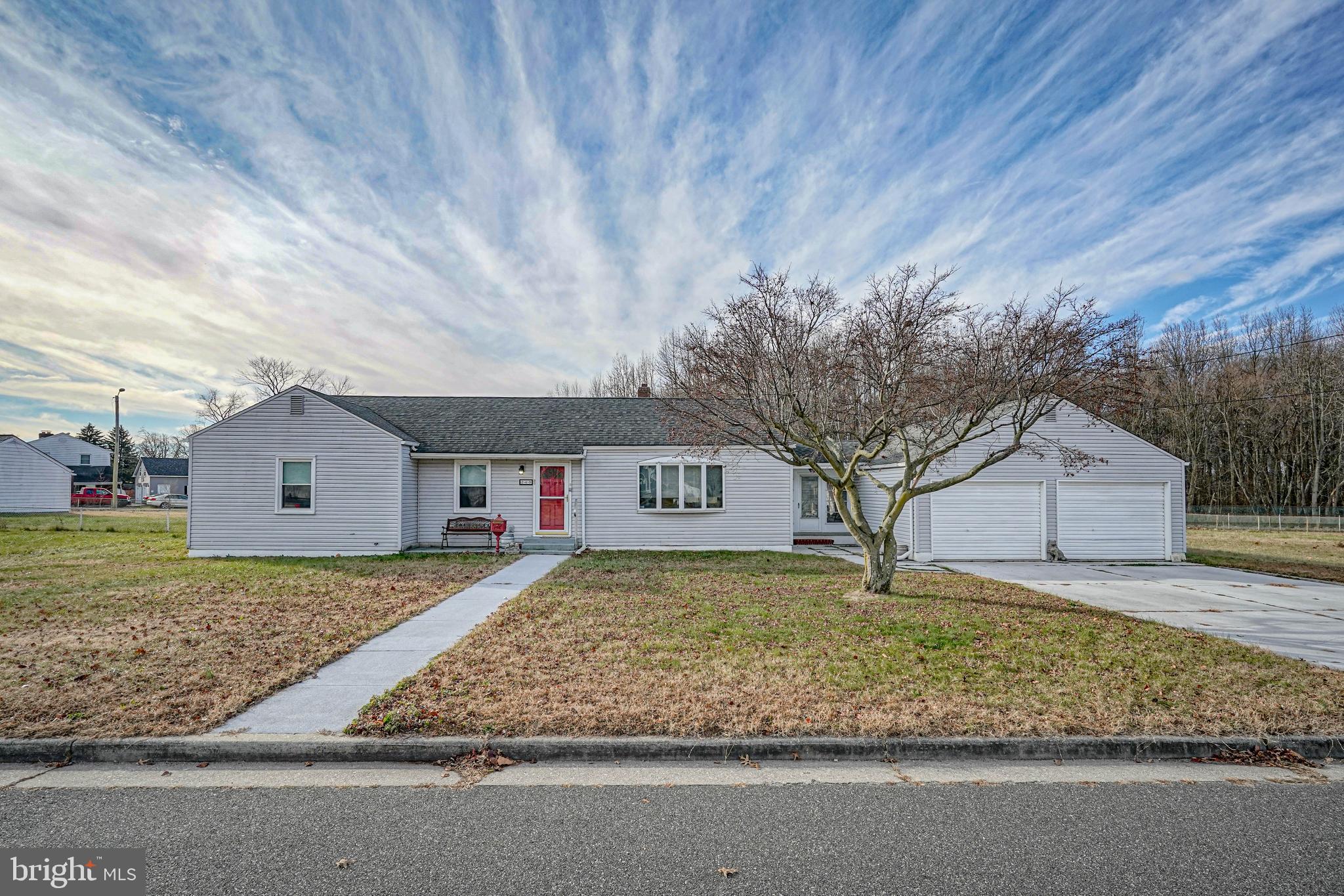 249 Cleveland Avenue Carneys Point, NJ 08069 - Photo 43 of 52 a front view of a house with a yard and garage