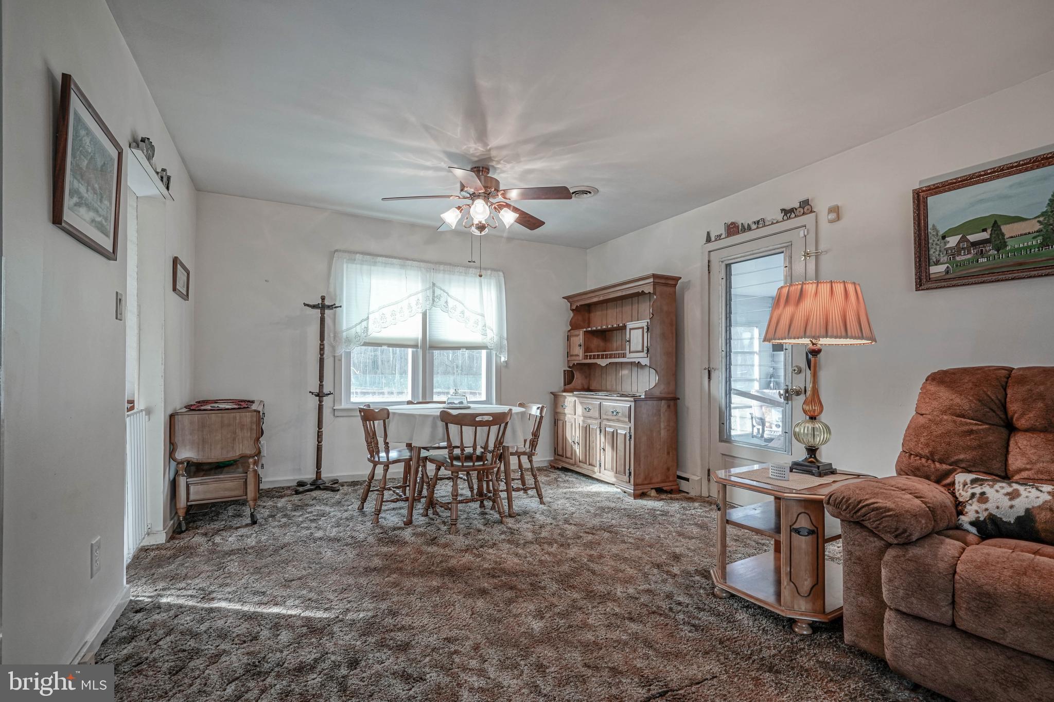 249 Cleveland Avenue Carneys Point, NJ 08069 - Photo 8 of 52 a living room with furniture two window and a table