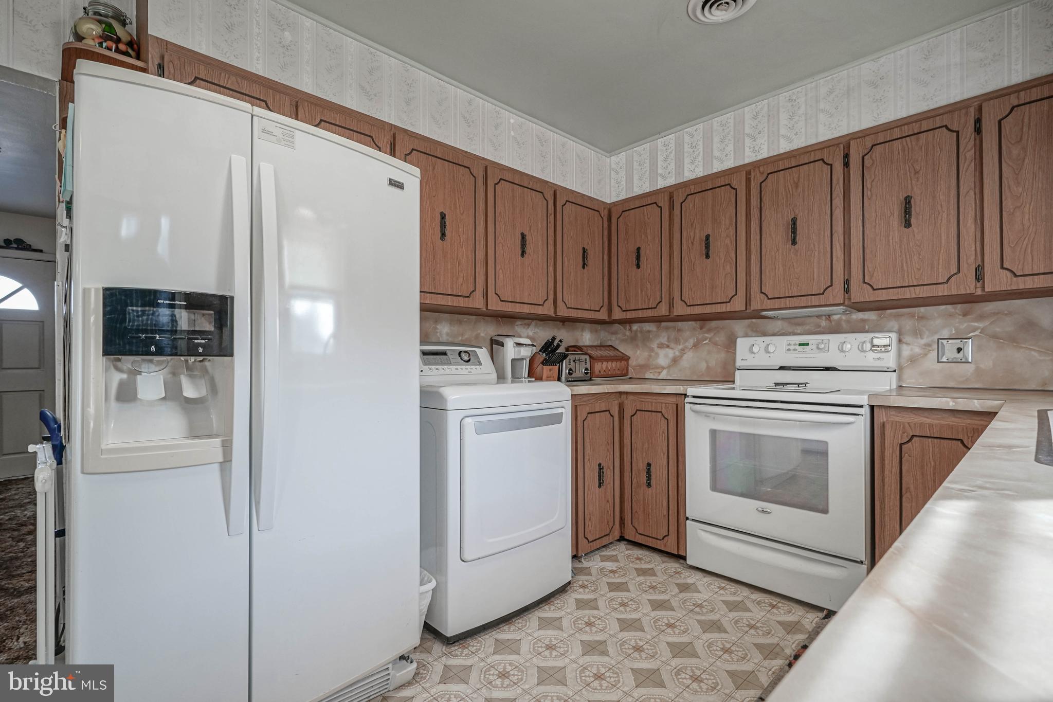 249 Cleveland Avenue Carneys Point, NJ 08069 - Photo 10 of 52 a kitchen with white cabinets and white appliances