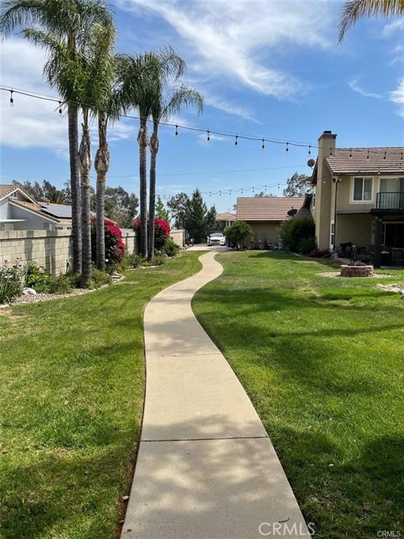12934 Arapaho Road, Unit A Rancho Cucamonga, CA 91739 - Photo 2 of 6 a front view of a house with garden