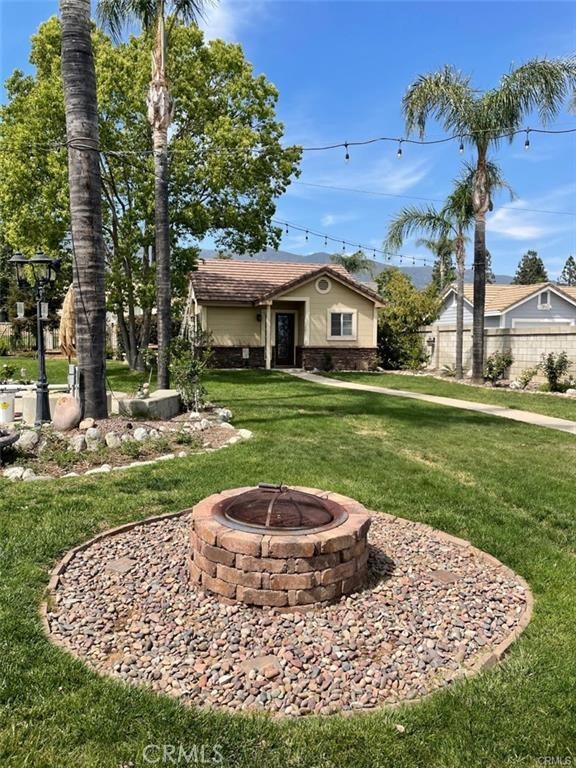 12934 Arapaho Road, Unit A Rancho Cucamonga, CA 91739 - Photo 3 of 6 a view of a house with a yard