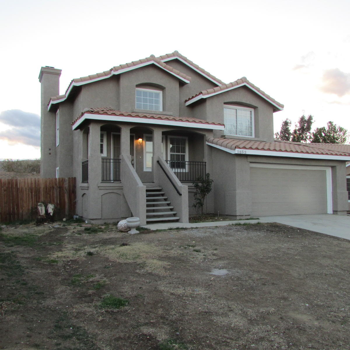 1832 Ivory Avenue Palmdale, CA 93550 - Photo 1 of 52 a front view of a house with a yard