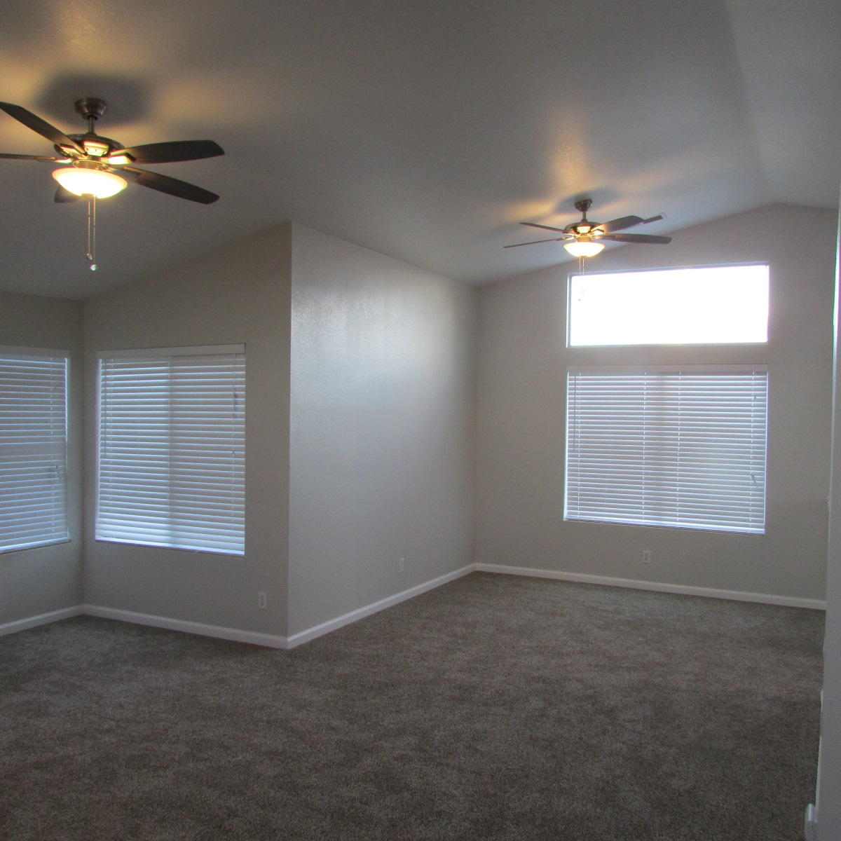 1832 Ivory Avenue Palmdale, CA 93550 - Photo 14 of 52 a view of an empty room with a window