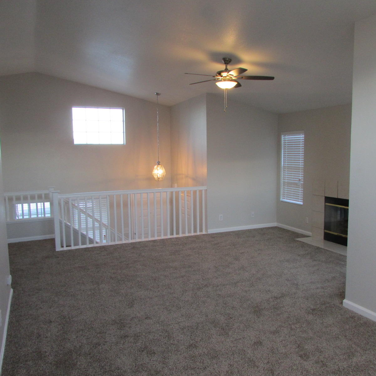 1832 Ivory Avenue Palmdale, CA 93550 - Photo 18 of 52 a view of a livingroom with a ceiling fan and window