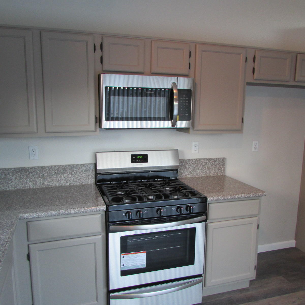 1832 Ivory Avenue Palmdale, CA 93550 - Photo 19 of 52 a kitchen with stainless steel appliances granite countertop a stove and a sink