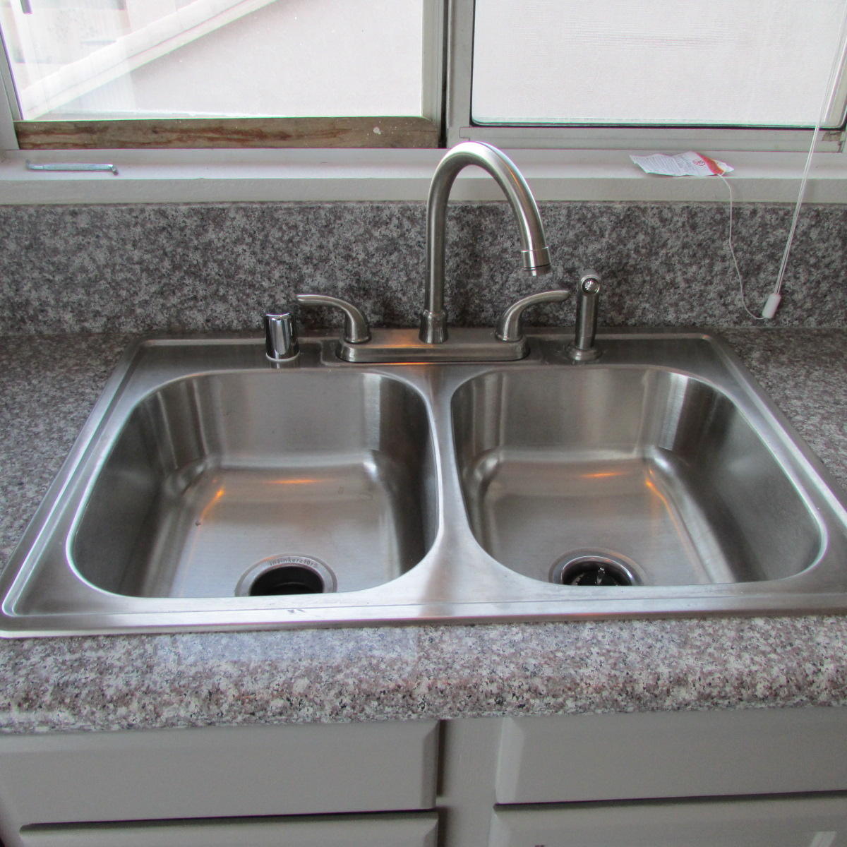 1832 Ivory Avenue Palmdale, CA 93550 - Photo 21 of 52 a close view of sink and tap