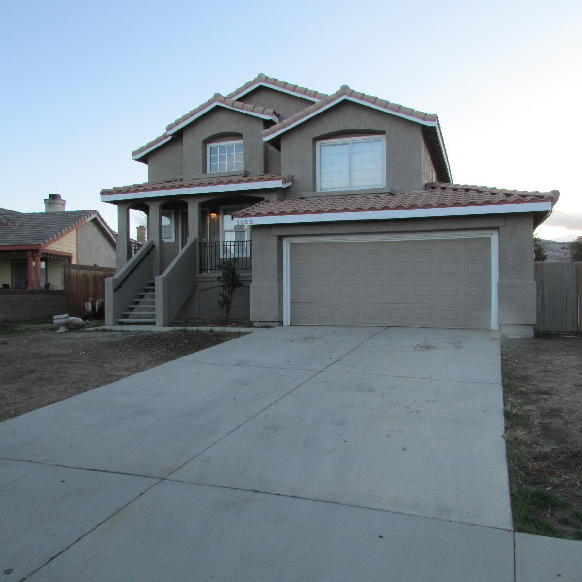 1832 Ivory Avenue Palmdale, CA 93550 - Photo 3 of 52 a front view of a house with a yard