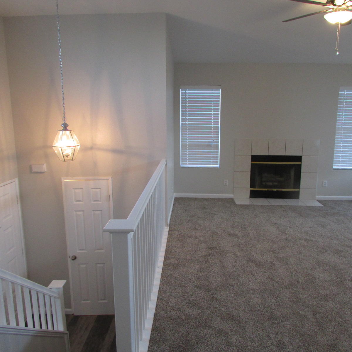 1832 Ivory Avenue Palmdale, CA 93550 - Photo 32 of 52 a view of a livingroom with an empty space and a fireplace