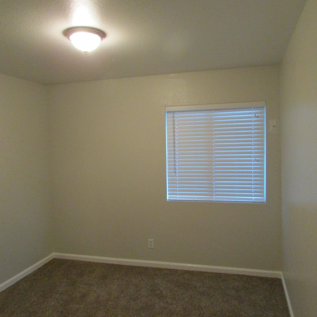 1832 Ivory Avenue Palmdale, CA 93550 - Photo 34 of 52 an empty room with a window
